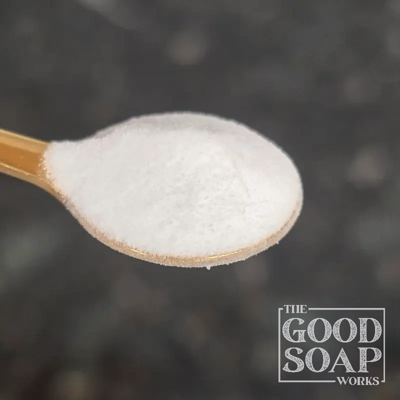 Panthenol Vitamin B5 powder on a wooden spoon — a skin and hair care ingredient