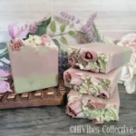 Heart Chakra Soap green and pink layered tallow soap with soap flowers and rose quartz crystals unlabeled