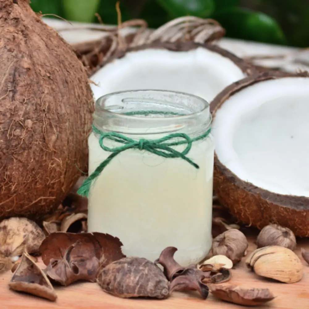 Coconut Oil with open raw coconuts