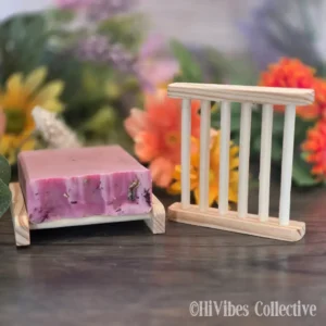 Bamboo soap dish ladder with evenly spaced dowel rungs, shown with a bar of soap resting on top