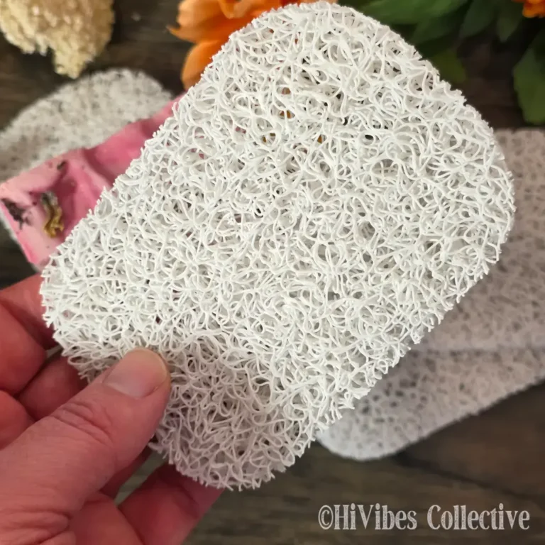 Compact soap saver pad in light grey, designed to lift soap above standing water for faster drying