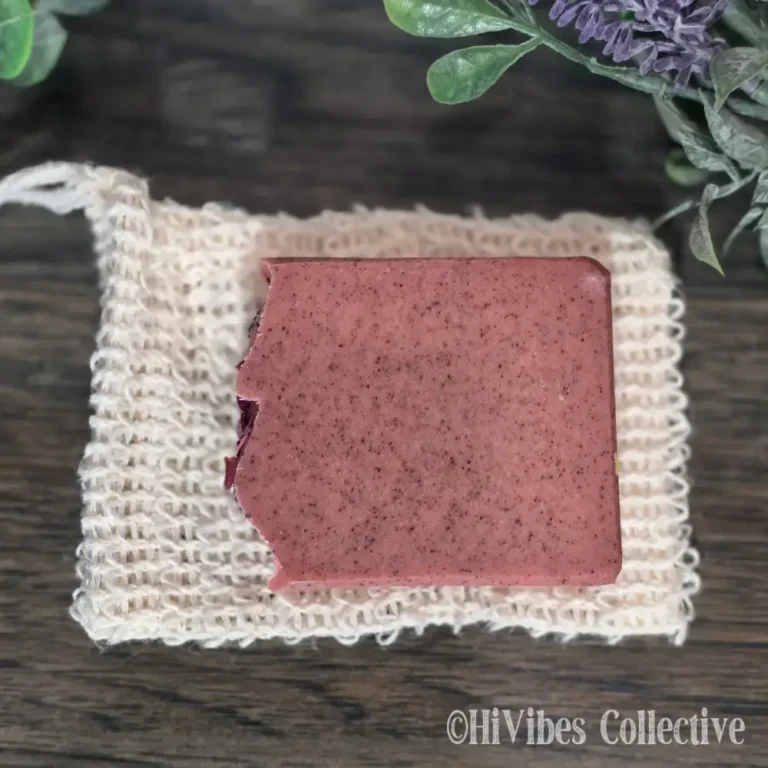 Sisal soap saver bag shown next to a full bar of handmade soap for size reference