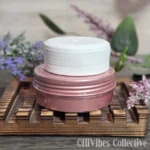 Sun & Shield natural sunscreen bar resting on a surface, showing its smooth solid texture