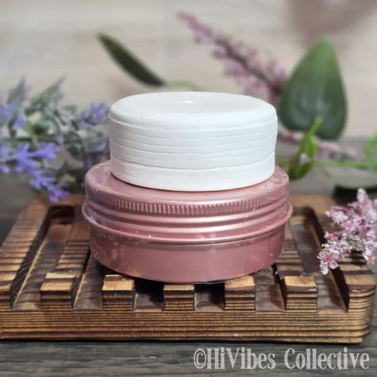 Sun & Shield natural sunscreen bar resting on a surface, showing its smooth solid texture
