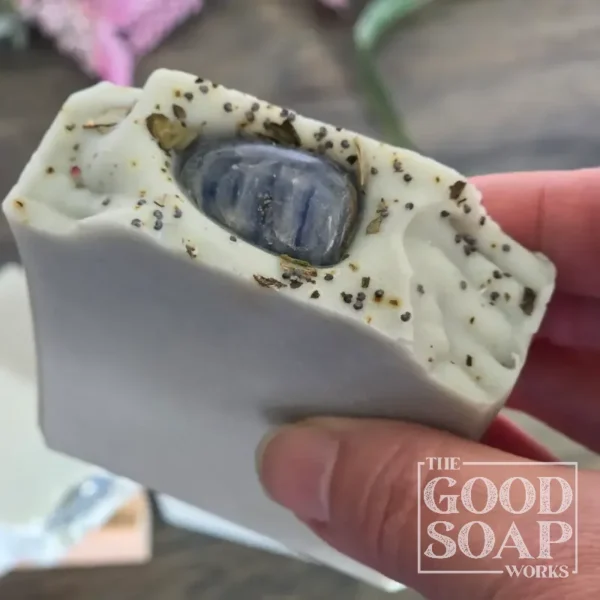 Throat Chakra Soap with Lepidolite - in hand showing top view