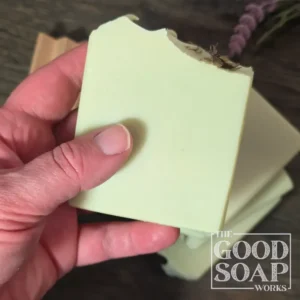 Herbalist's Tallow Soap in hand showing Side View