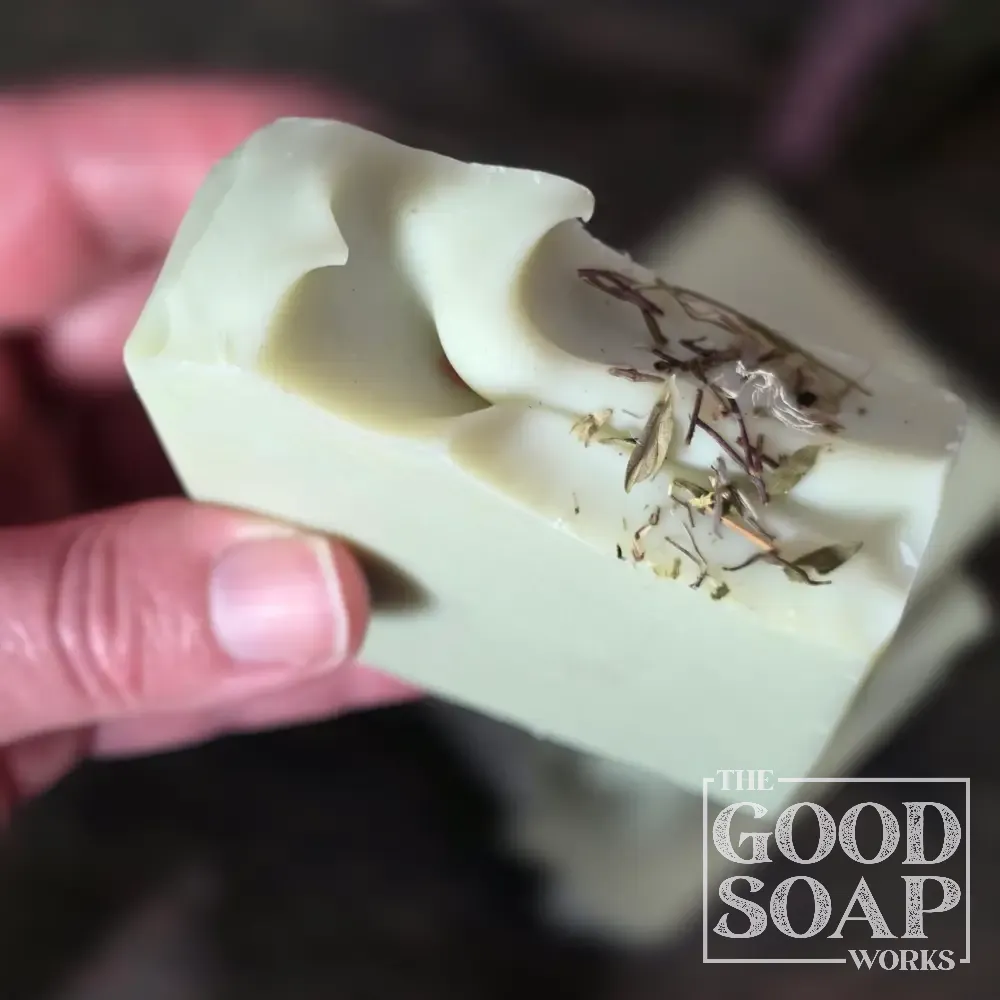 Herbalist's Tallow Soap in hand showing Top View
