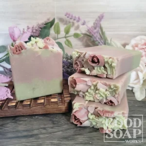 Heart Chakra Soap green and pink layered tallow soap with soap flowers and rose quartz crystals unlabeled