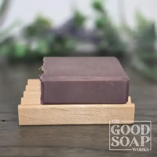 Flat alder wood soap dish with our Violet & Mint Soap to show size - side view