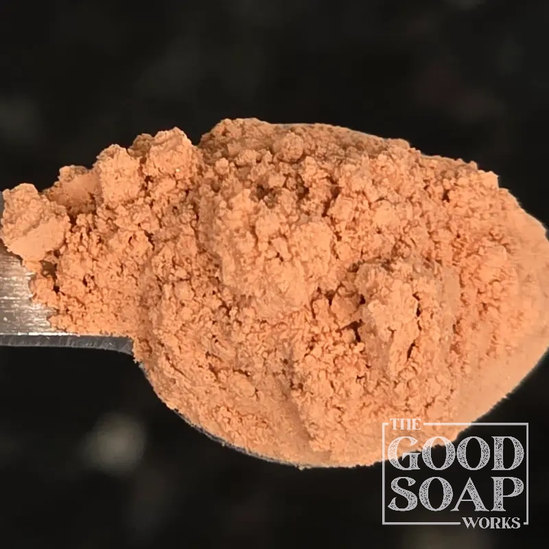 Close-up of Antique Rose Clay powder on a spoon, a gentle clay ingredient used in soap and skincare by The Good Soap Works Co.
