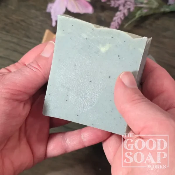 Blue Atlas Soap held showing Side View