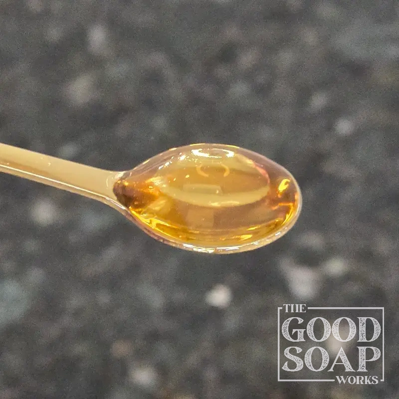 Close-up of Broccoli Seed Oil on a spoon, a carrier oil ingredient used by The Good Soap Works Co.