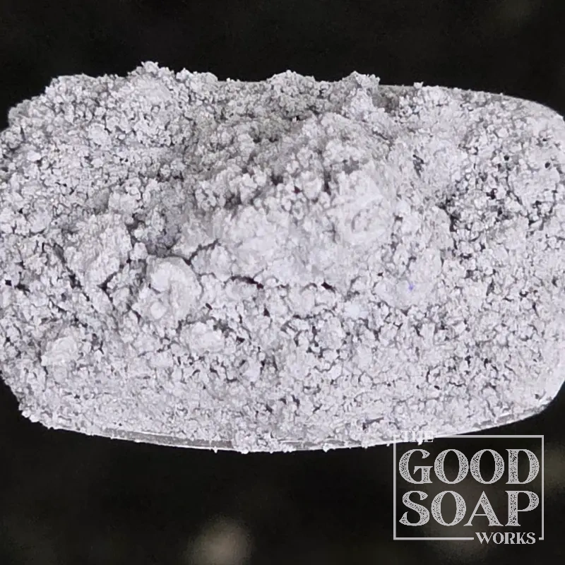 Close-up of Cambrian Blue Clay powder on a spoon, a mineral-rich ingredient used in soap and skincare by The Good Soap Works Co.
