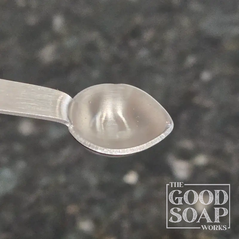 Close-up of Decyl Glucoside on a spoon, a gentle surfactant ingredient used by The Good Soap Works Co.