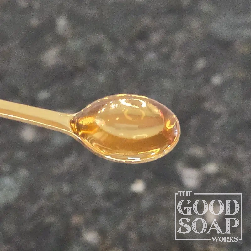 Close-up of Ethylhexylglycerin on a spoon, a preservative ingredient used by The Good Soap Works Co.