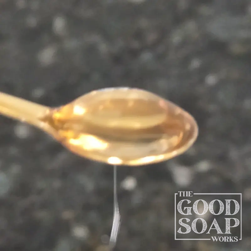 Close-up of Germall Plus preservative powder on a spoon, an ingredient used in soap and skincare by The Good Soap Works Co.
