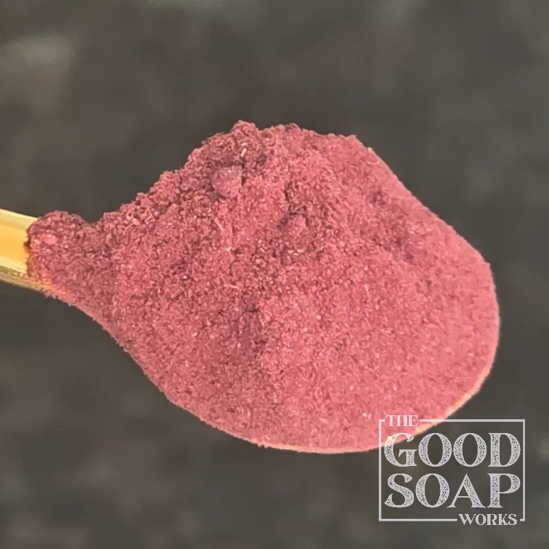 Close-up of Hibiscus powder on a spoon, a natural colorant and botanical ingredient used in soap and skincare by The Good Soap Works Co.