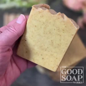 Holiday Woods Tallow Soap side view golden brown tallow soap with activated charcoal and black cacao