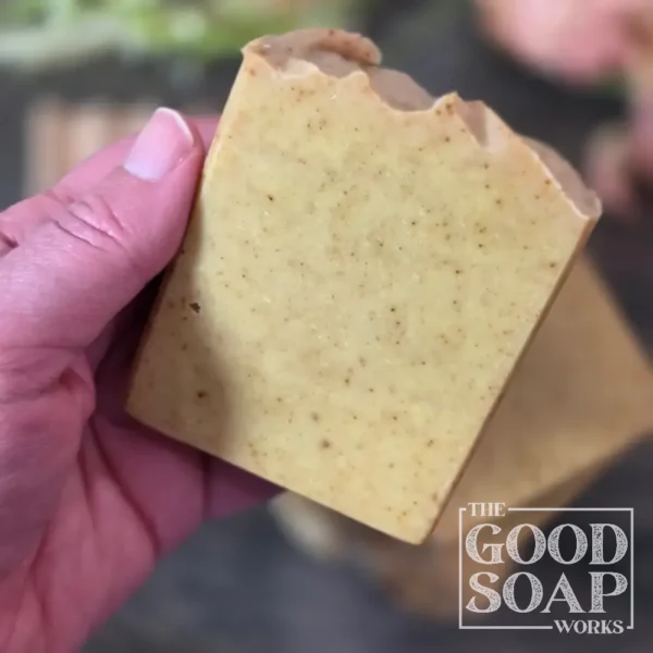Holiday Woods Tallow Soap side view golden brown tallow soap with activated charcoal and black cacao