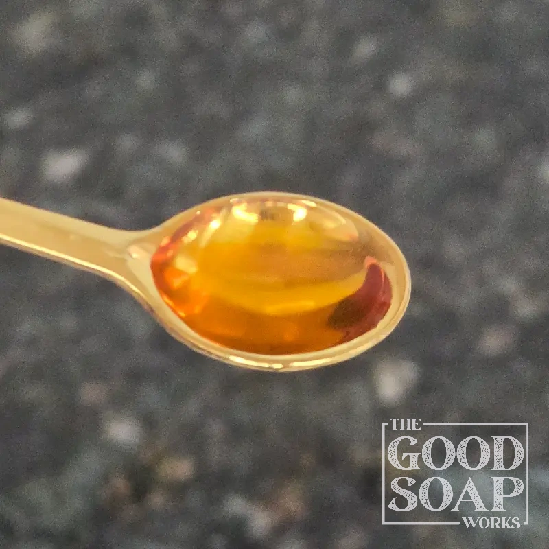 Close-up of Hydrolyzed Rice Protein on a spoon, a conditioning ingredient used in soap and skincare by The Good Soap Works Co.