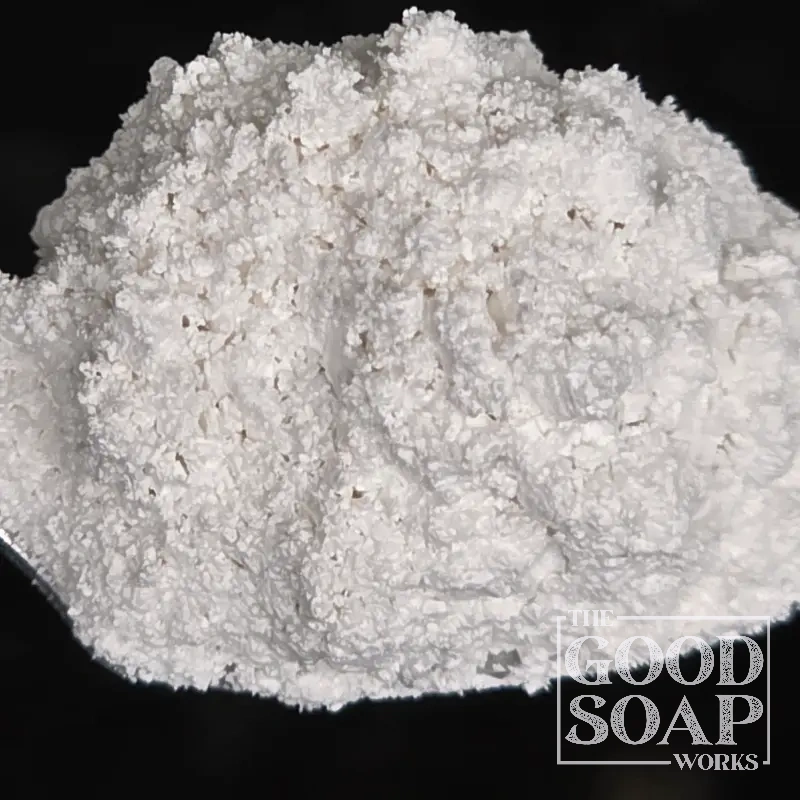 Close-up of Kaolin Clay powder on a spoon, a gentle cleansing ingredient used in soap and skincare by The Good Soap Works Co.