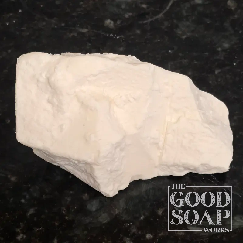 Block of Kokum Butter showing its hard, white solid texture, a natural butter used in soap and skincare by The Good Soap Works Co.