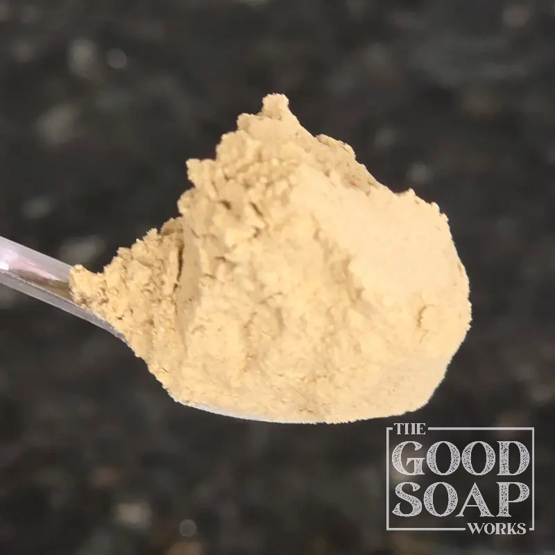Close-up of Licorice Root powder on a spoon, a skin-brightening ingredient used in soap and skincare by The Good Soap Works Co.