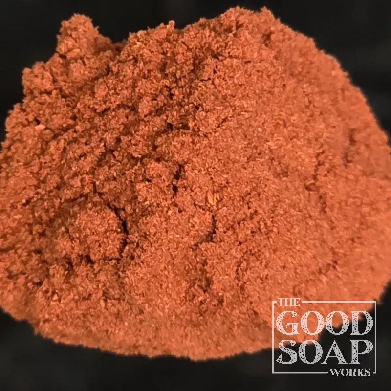 Close-up of Madder Root powder on a spoon, a natural colorant ingredient used in soap by The Good Soap Works Co.