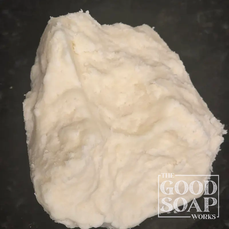 Block of Mango Butter showing its pale yellow solid texture, a natural butter used in soap and skincare by The Good Soap Works Co.