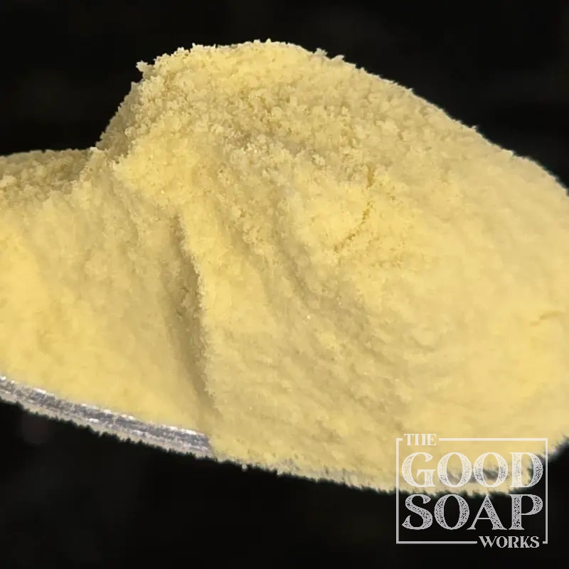 Close-up of Mango Powder on a spoon, a powder ingredient used in soap and skincare by The Good Soap Works Co.