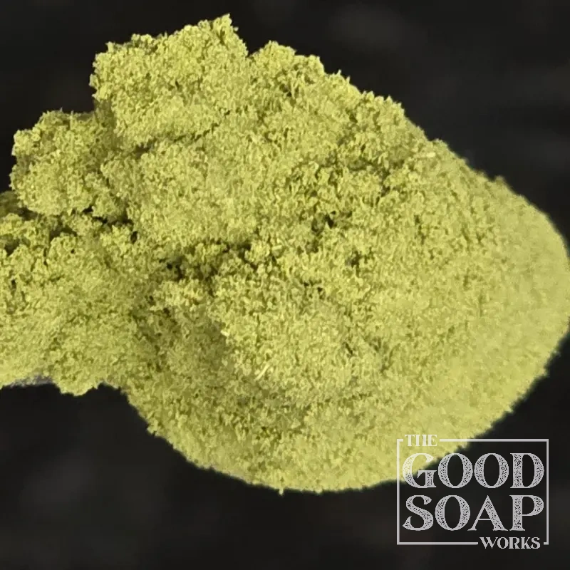 Moringa powder — a deep green botanical superfood powder used as a natural colorant in handmade soap
