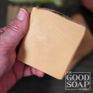 Refresh & Restore Spa Soap sitting in hand showing side views
