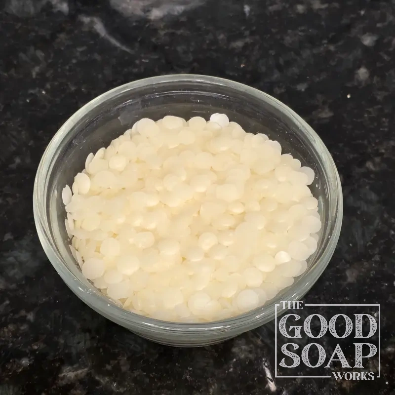 Rice bran wax close-up — a natural vegetable wax used in lip care and solid cosmetic formulations