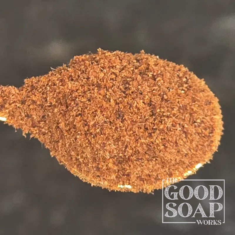 Rosehip powder on a wooden spoon — a natural botanical ingredient and colorant for handmade soap and skincare