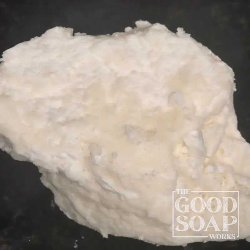 Chunk of raw shea butter — an unrefined plant butter used in handmade soap and natural body care