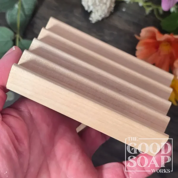Flat alder wood soap dish being held in had to show size