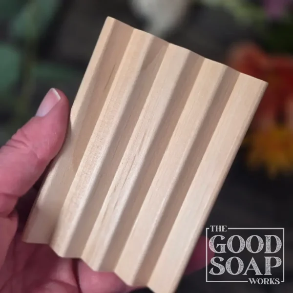 Flat alder wood soap dish being held in had to show size