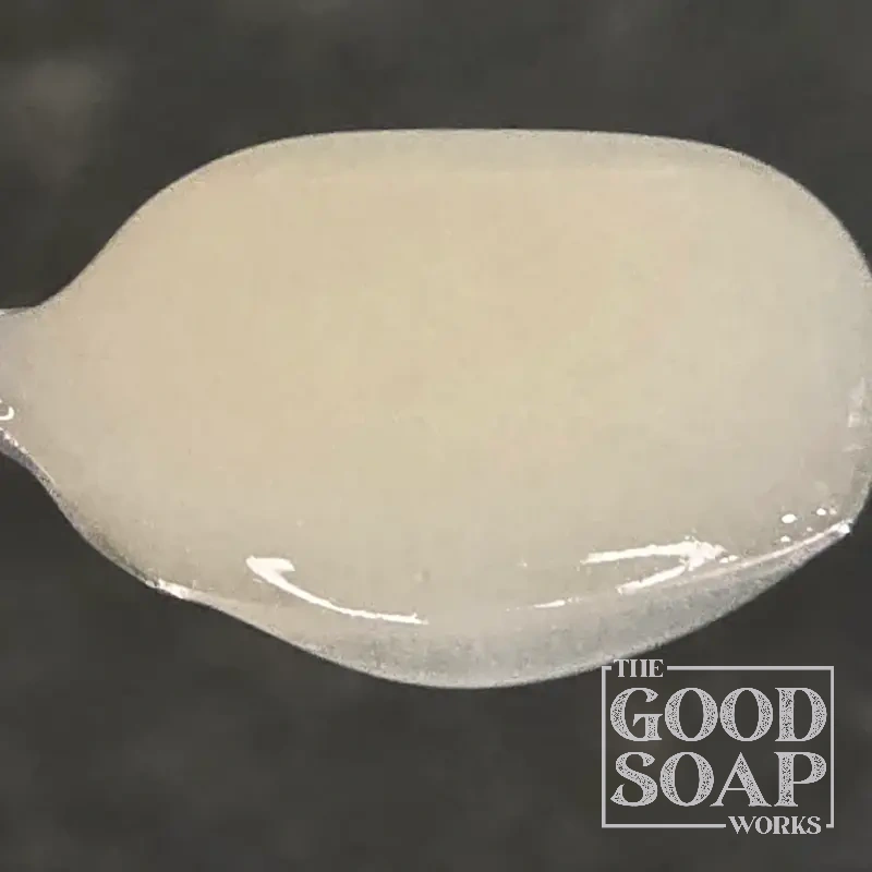 Sodium cocoamphoacetate on a spoon — a mild coconut-derived cleanser used in natural hair and skin care