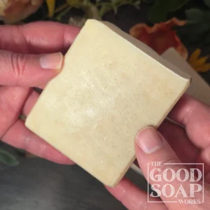 Tallow & Goat Milk Soap in hand showing side