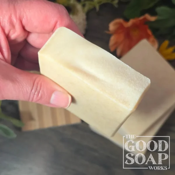 Tallow & Goat Milk Soap in hand showing top